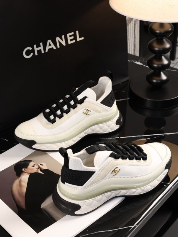 sy_no_BCB44C72A0CBB640D9AFA7D630A9F012_1 Chanel White and Black Mixed Material Low-Top Sneaker with Gold Hardware CC Logo