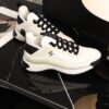 sy_no_BCB44C72A0CBB640D9AFA7D630A9F012_3 Chanel White and Black Mixed Material Low-Top Sneaker with Gold Hardware CC Logo