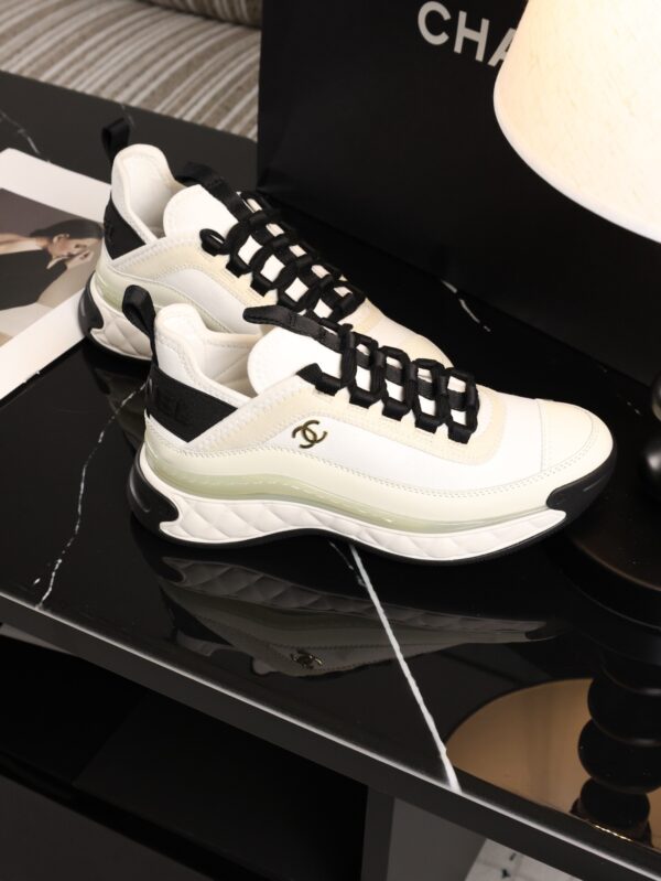sy_no_BCB44C72A0CBB640D9AFA7D630A9F012_3 Chanel White and Black Mixed Material Low-Top Sneaker with Gold Hardware CC Logo