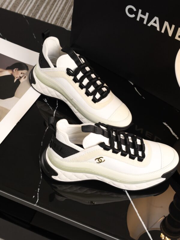sy_no_BCB44C72A0CBB640D9AFA7D630A9F012_5 Chanel White and Black Mixed Material Low-Top Sneaker with Gold Hardware CC Logo