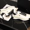 sy_no_BCB44C72A0CBB640D9AFA7D630A9F012_6 Chanel White and Black Mixed Material Low-Top Sneaker with Gold Hardware CC Logo