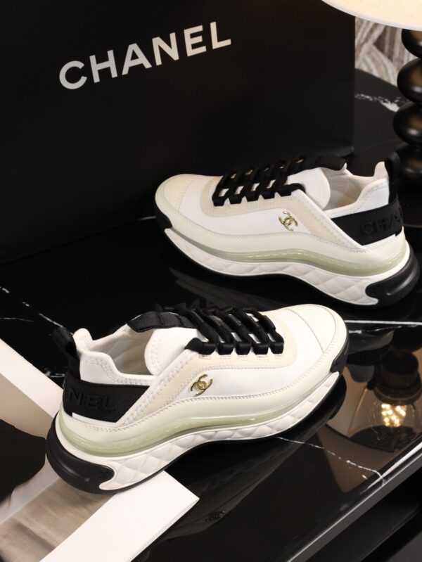 sy_no_BCB44C72A0CBB640D9AFA7D630A9F012_7 Chanel White and Black Mixed Material Low-Top Sneaker with Gold Hardware CC Logo