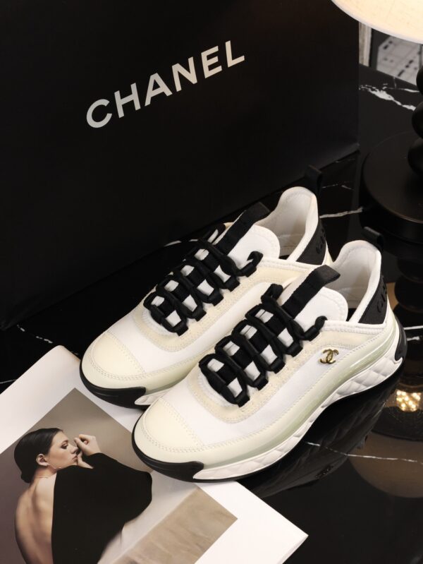 sy_no_BCB44C72A0CBB640D9AFA7D630A9F012_8 Chanel White and Black Mixed Material Low-Top Sneaker with Gold Hardware CC Logo