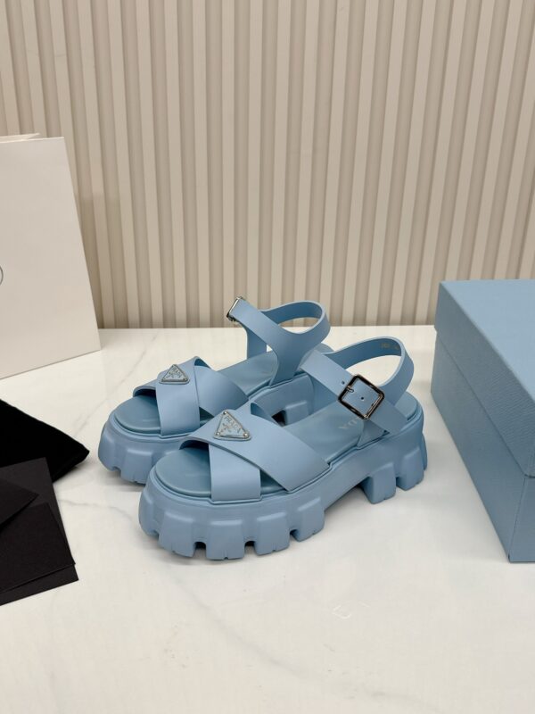 sy_no_BD510FB83BFDC48F53E036898192A523_1 Prada Dusty Blue Triangle Logo Gear Platform Sandal