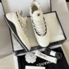 sy_no_BF7CC282A9A113B66A93CE065E6B9981_0 Chanel White Knit and Suede Slip-On Low-Top Sneaker with Speckled Laces and CC Logo