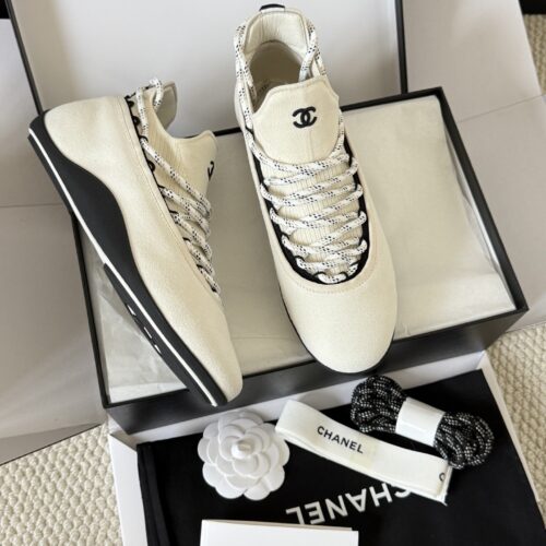 sy_no_BF7CC282A9A113B66A93CE065E6B9981_0 Chanel White Knit and Suede Slip-On Low-Top Sneaker with Speckled Laces and CC Logo