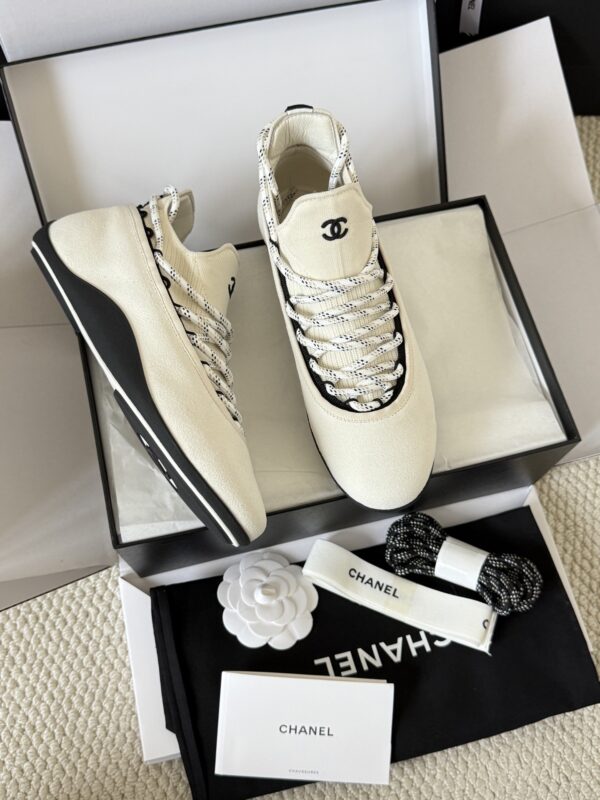 sy_no_BF7CC282A9A113B66A93CE065E6B9981_0 Chanel White Knit and Suede Slip-On Low-Top Sneaker with Speckled Laces and CC Logo