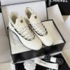 sy_no_BF7CC282A9A113B66A93CE065E6B9981_1 Chanel White Knit and Suede Slip-On Low-Top Sneaker with Speckled Laces and CC Logo