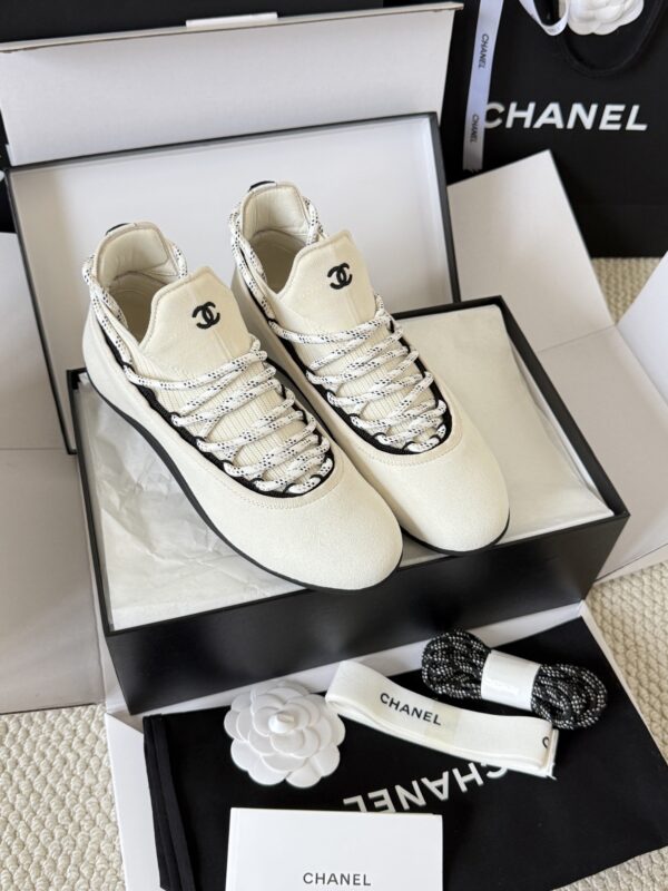sy_no_BF7CC282A9A113B66A93CE065E6B9981_1 Chanel White Knit and Suede Slip-On Low-Top Sneaker with Speckled Laces and CC Logo