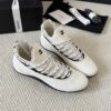sy_no_BF7CC282A9A113B66A93CE065E6B9981_2 Chanel White Knit and Suede Slip-On Low-Top Sneaker with Speckled Laces and CC Logo