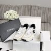 sy_no_C162CBC71143F9067B183CD82A26A850_0 Chanel Off-White and Black Mixed Material Low-Top Sneaker with Suede and CC Logo