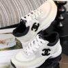 sy_no_C162CBC71143F9067B183CD82A26A850_1 Chanel Off-White and Black Mixed Material Low-Top Sneaker with Suede and CC Logo