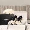 Chanel Off-White and Black Mixed Material Low-Top Sneaker with Contrast Piping and CC Logo
