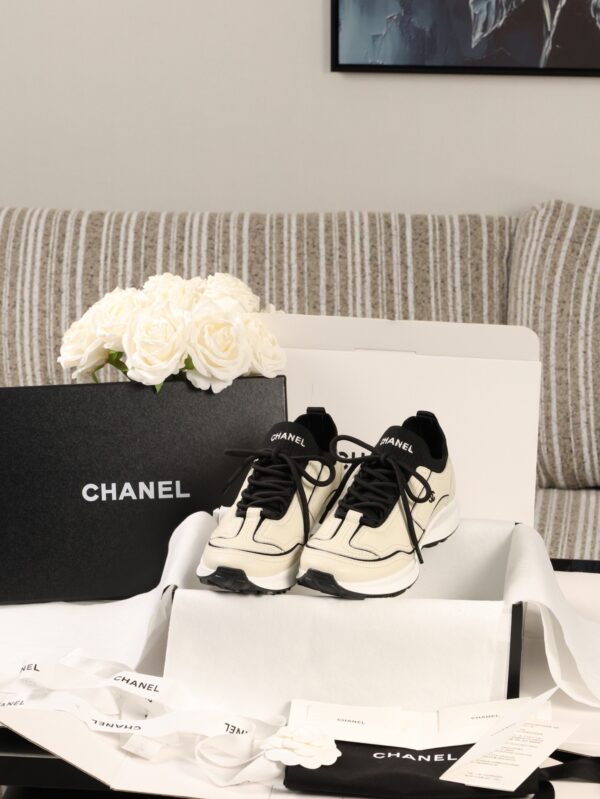 Chanel Off-White and Black Mixed Material Low-Top Sneaker with Contrast Piping and CC Logo