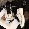 Chanel Off-White and Black Mixed Material Low-Top Sneaker with Contrast Piping and CC Logo