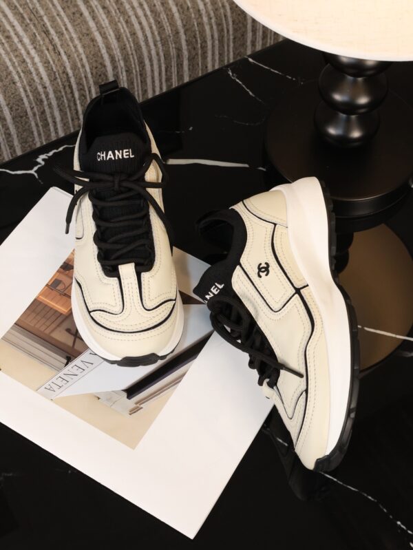 Chanel Off-White and Black Mixed Material Low-Top Sneaker with Contrast Piping and CC Logo
