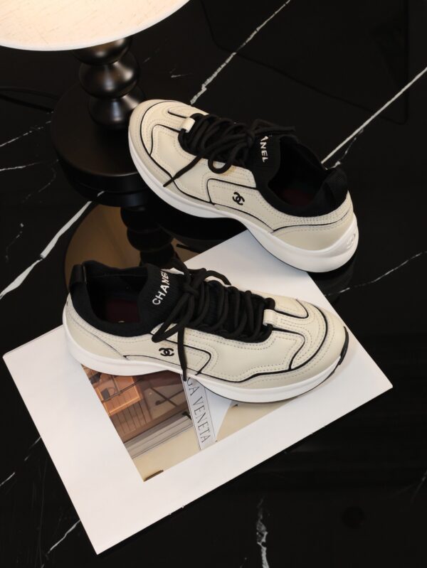Chanel Off-White and Black Mixed Material Low-Top Sneaker with Contrast Piping and CC Logo
