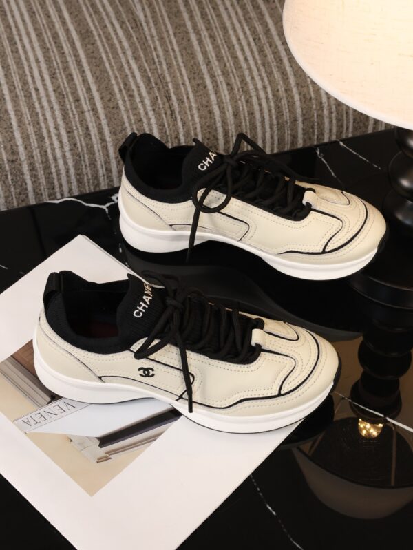 Chanel Off-White and Black Mixed Material Low-Top Sneaker with Contrast Piping and CC Logo