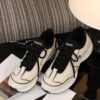 Chanel Off-White and Black Mixed Material Low-Top Sneaker with Contrast Piping and CC Logo