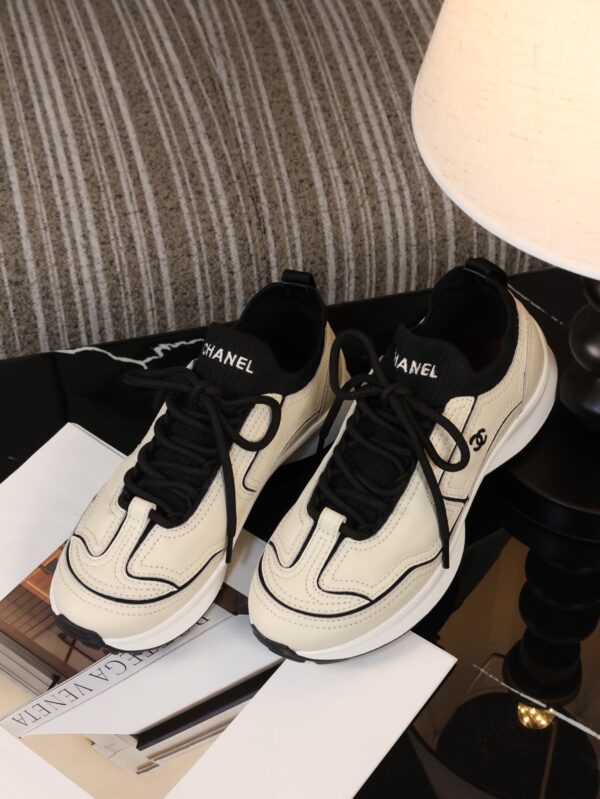 Chanel Off-White and Black Mixed Material Low-Top Sneaker with Contrast Piping and CC Logo