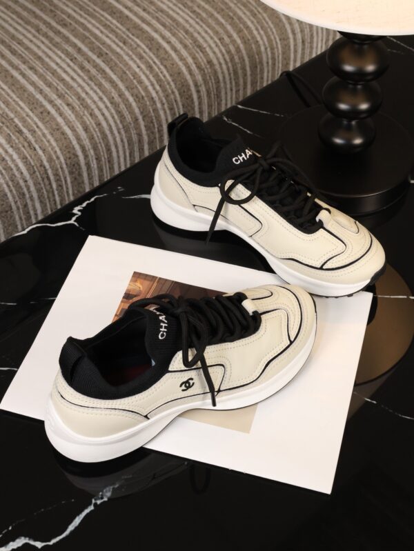 Chanel Off-White and Black Mixed Material Low-Top Sneaker with Contrast Piping and CC Logo