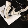 Chanel Off-White and Black Mixed Material Low-Top Sneaker with Contrast Piping and CC Logo