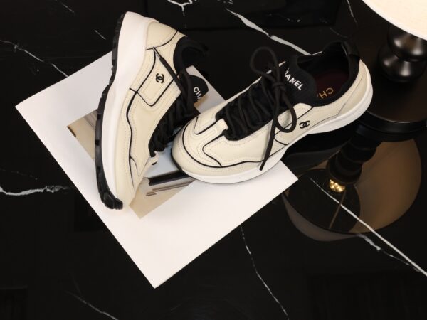 Chanel Off-White and Black Mixed Material Low-Top Sneaker with Contrast Piping and CC Logo
