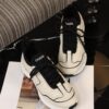 Chanel Off-White and Black Mixed Material Low-Top Sneaker with Contrast Piping and CC Logo