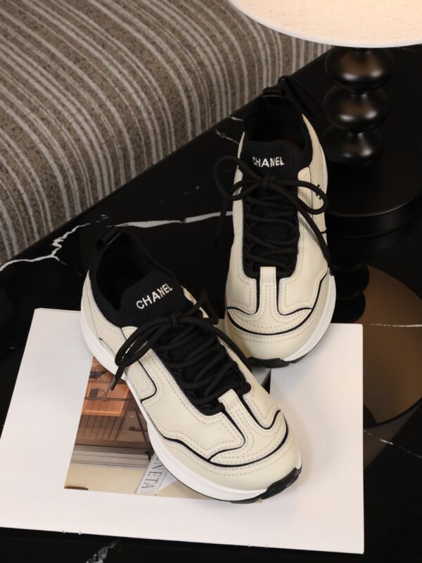 Chanel Off-White and Black Mixed Material Low-Top Sneaker with Contrast Piping and CC Logo