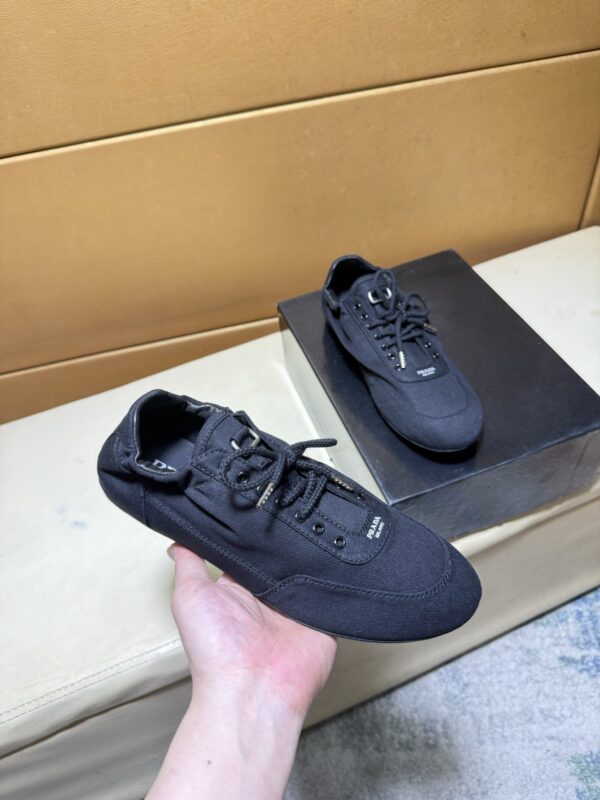 sy_no_C44A7E141A092C44C8C8B4C32CFD433D_0 Prada Black Gathered Nylon Retro Trainer