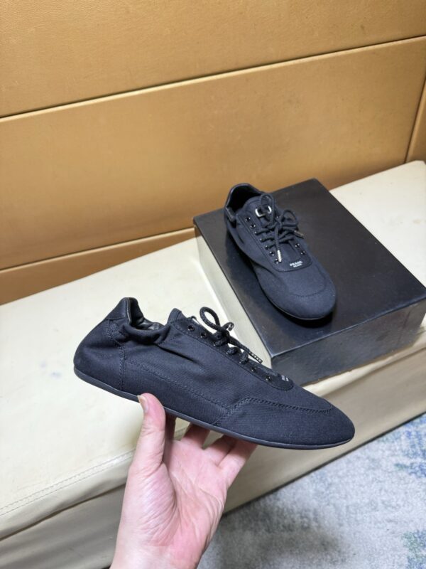 sy_no_C44A7E141A092C44C8C8B4C32CFD433D_1 Prada Black Gathered Nylon Retro Trainer