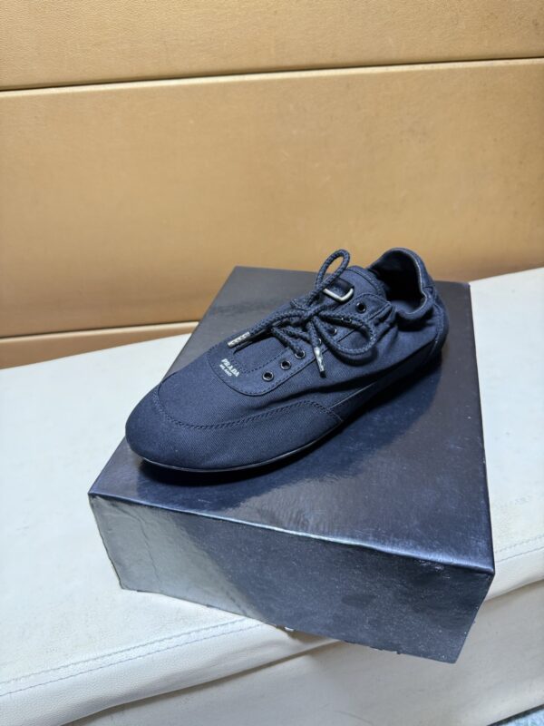 sy_no_C44A7E141A092C44C8C8B4C32CFD433D_2 Prada Black Gathered Nylon Retro Trainer