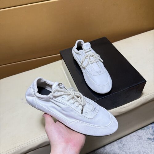 sy_no_C5B5DA905A6FC77396342367800B25DD_0 Prada Off-White Gathered Nylon Retro Trainer