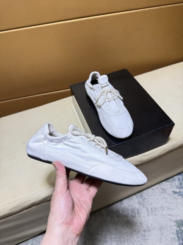 sy_no_C5B5DA905A6FC77396342367800B25DD_1 Prada Off-White Gathered Nylon Retro Trainer