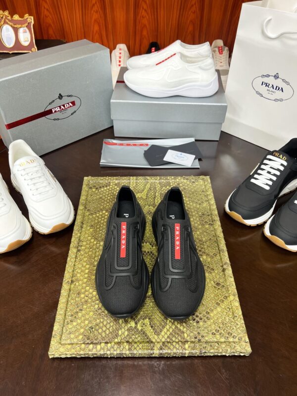 sy_no_C7382AE8A59B8FB653E6C65C272C6891_0 Prada Black Knit Red-Label Slip-On Platform Sneaker