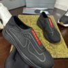 sy_no_C7382AE8A59B8FB653E6C65C272C6891_1 Prada Black Knit Red-Label Slip-On Platform Sneaker
