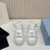 sy_no_C9ADD3A02F6444BB0F83DC03424EDD43_1 Prada White Triangle Logo Gear Platform Sandal
