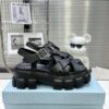 sy_no_CBE74BEF0A80EACA11D3EC219F2ED384_0 Prada Black Woven Roman Gear Platform Sandal