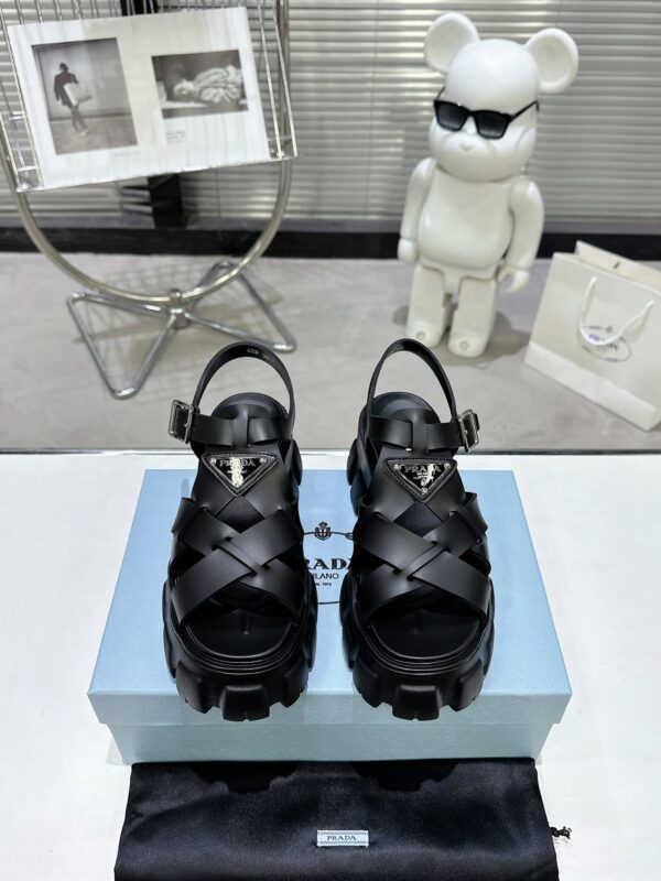 sy_no_CBE74BEF0A80EACA11D3EC219F2ED384_1 Prada Black Woven Roman Gear Platform Sandal
