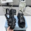 sy_no_CBE74BEF0A80EACA11D3EC219F2ED384_2 Prada Black Woven Roman Gear Platform Sandal