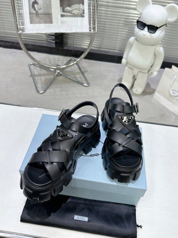sy_no_CBE74BEF0A80EACA11D3EC219F2ED384_3 Prada Black Woven Roman Gear Platform Sandal