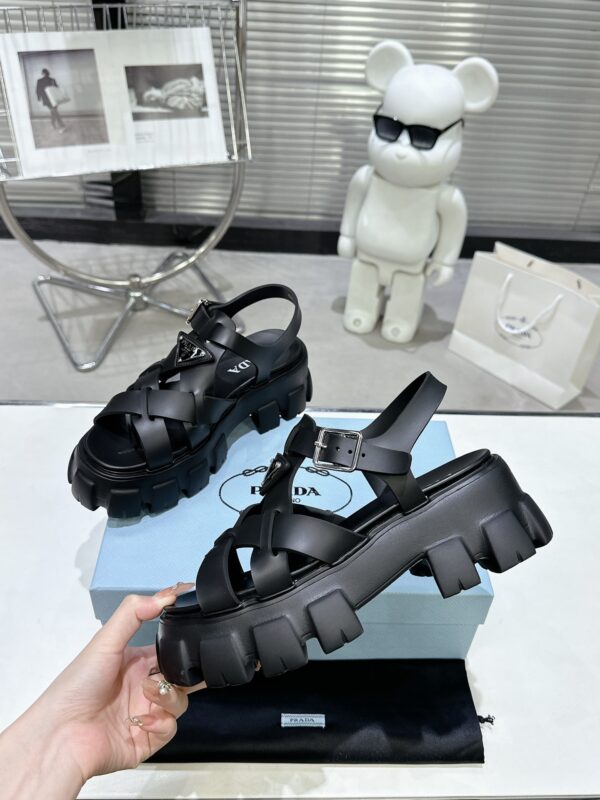 sy_no_CBE74BEF0A80EACA11D3EC219F2ED384_4 Prada Black Woven Roman Gear Platform Sandal