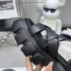 sy_no_CBE74BEF0A80EACA11D3EC219F2ED384_7 Prada Black Woven Roman Gear Platform Sandal