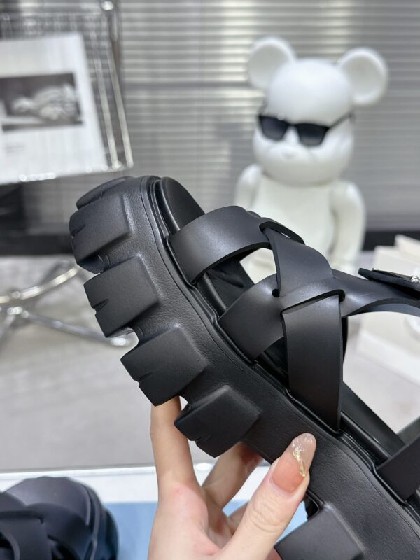 sy_no_CBE74BEF0A80EACA11D3EC219F2ED384_7 Prada Black Woven Roman Gear Platform Sandal