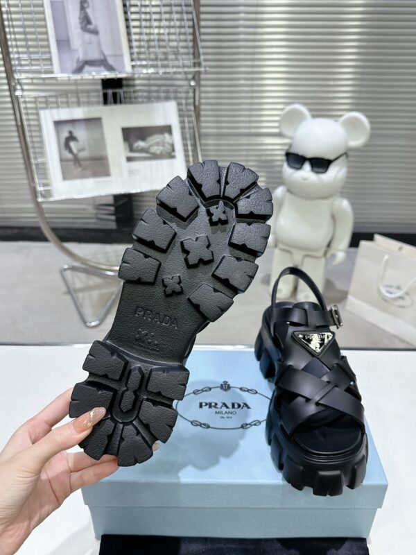 sy_no_CBE74BEF0A80EACA11D3EC219F2ED384_8 Prada Black Woven Roman Gear Platform Sandal