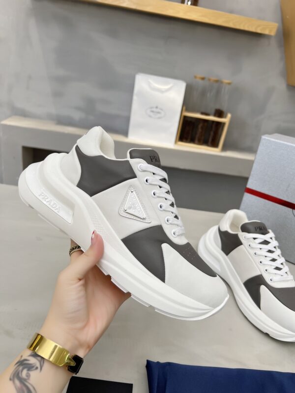 sy_no_D1F6D8B9B16A922686241214F2473B24_0 Prada Grey White Triangle Logo Platform Sneaker