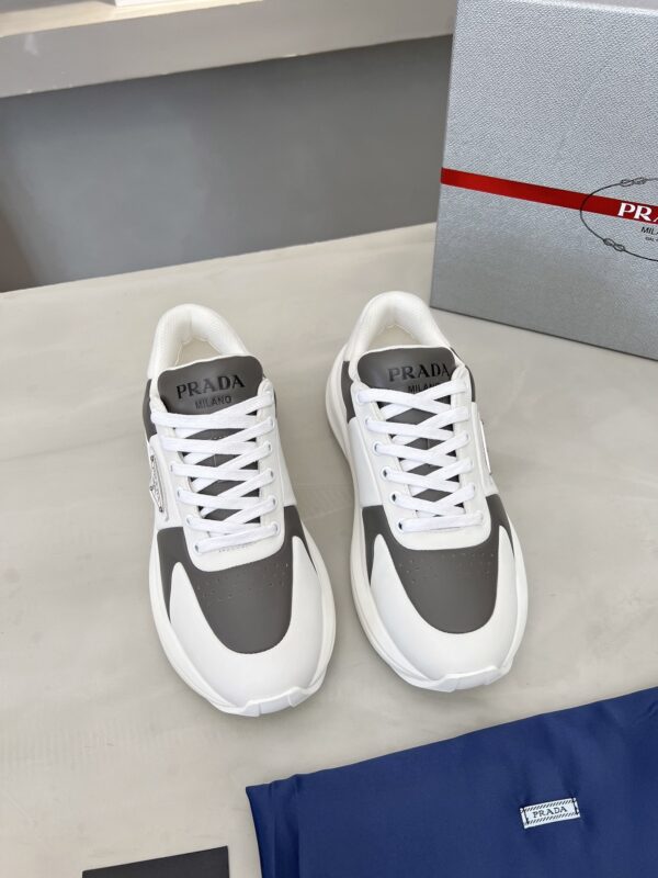 sy_no_D1F6D8B9B16A922686241214F2473B24_1 Prada Grey White Triangle Logo Platform Sneaker