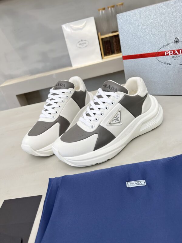 sy_no_D1F6D8B9B16A922686241214F2473B24_3 Prada Grey White Triangle Logo Platform Sneaker