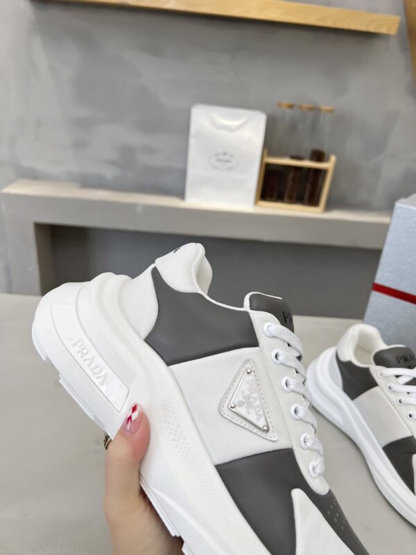 sy_no_D1F6D8B9B16A922686241214F2473B24_6 Prada Grey White Triangle Logo Platform Sneaker