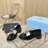 Prada Black Patent Metal Ring Pearl Block-Heel Loafer